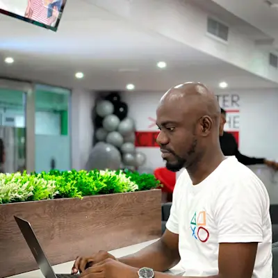Man working on laptop illustrating local service leader success with Altuin Loop.